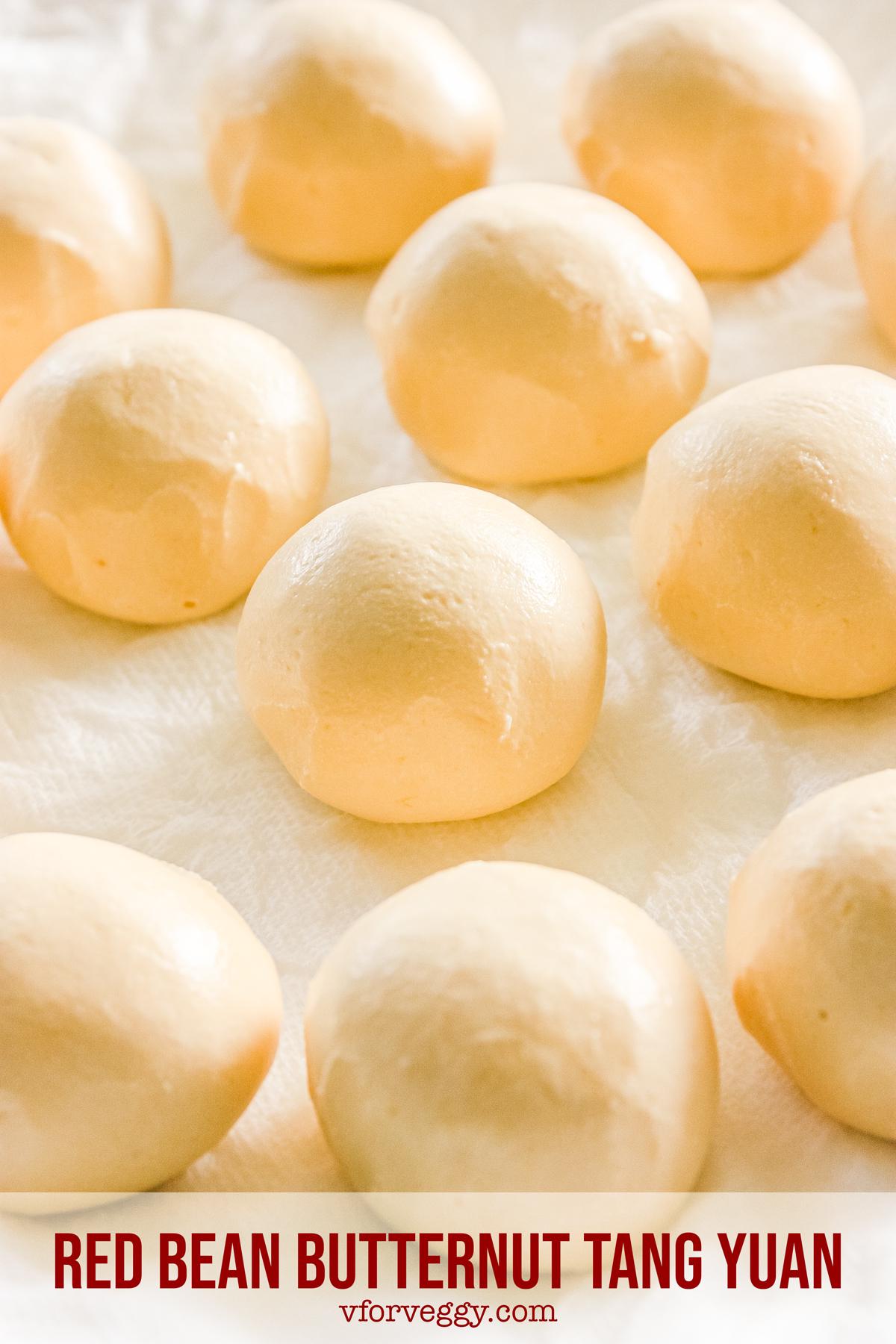 Red bean butternut tang yuan, shaped and filled, ready to be cooked.