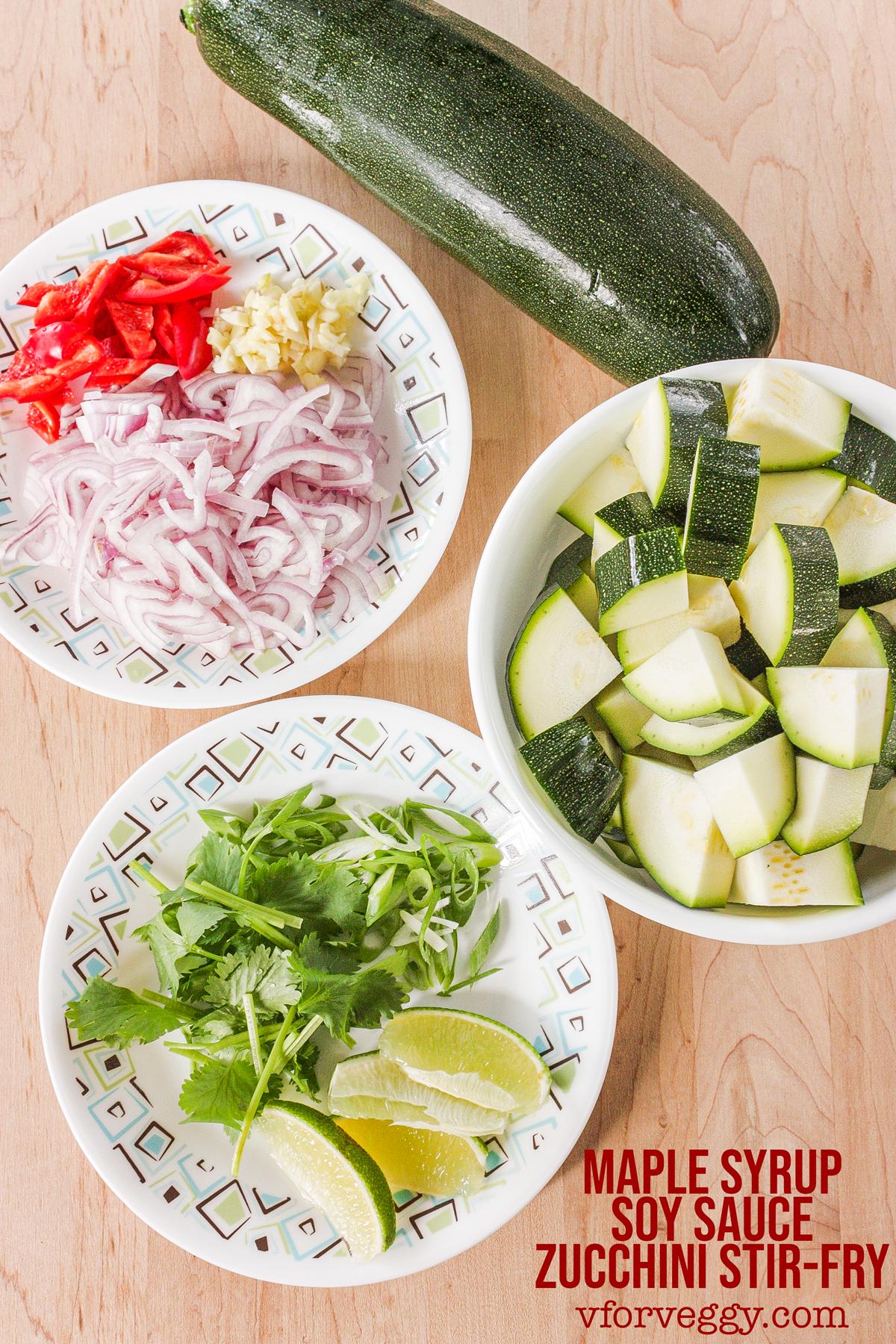 Ingredients for maple syrup soy sauce zucchini stir-fry: zucchini, red chilies, garlic, shallot, scallion, cilantro, and lime.