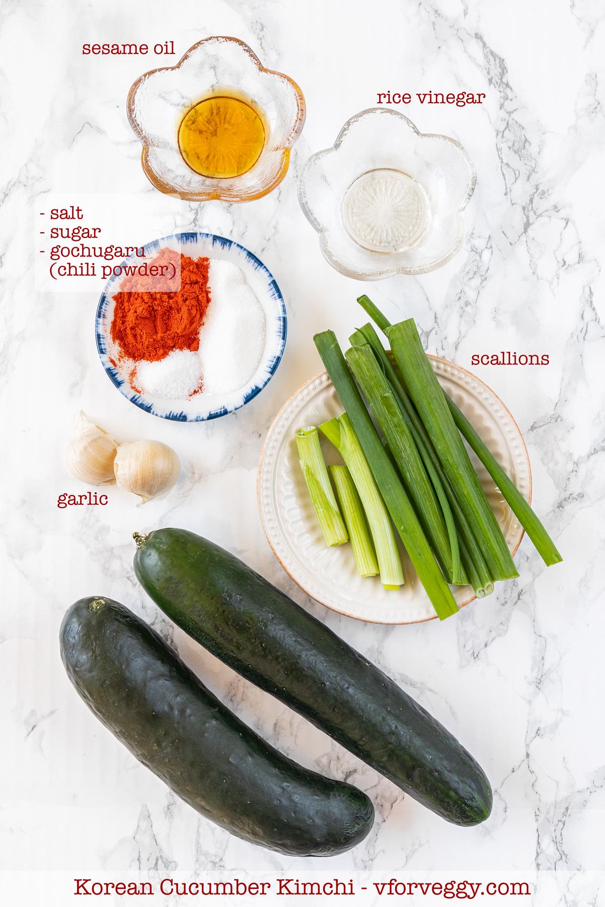 Ingredients for Korean cucumber kimchi: cucumber, garlic, scallion, gochugaru, sugar, salt, rice vinegar, and sesame oil.